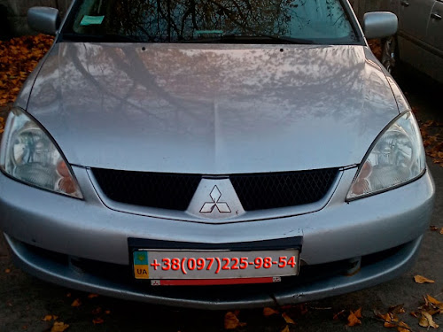 Замена передних тормозных колодок на Mitsubishi Lancer 9